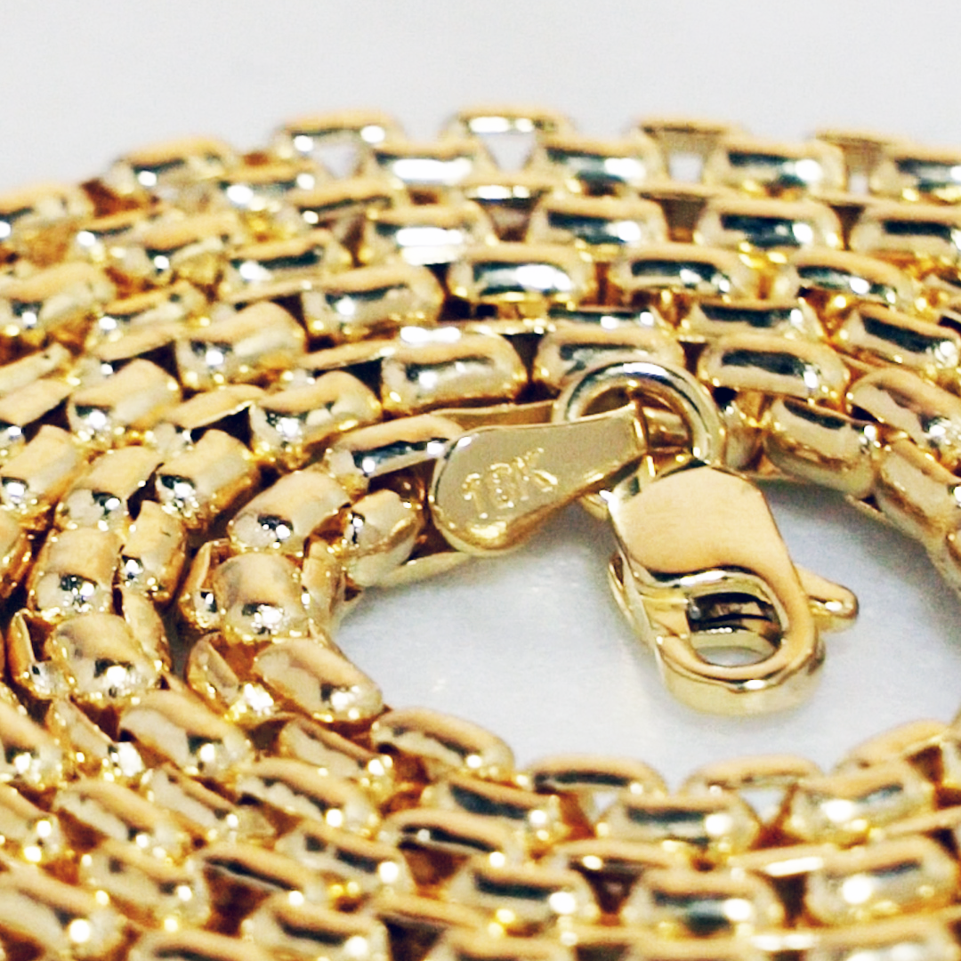 Close-up of a rounded box bracelet with a clasp on a white background