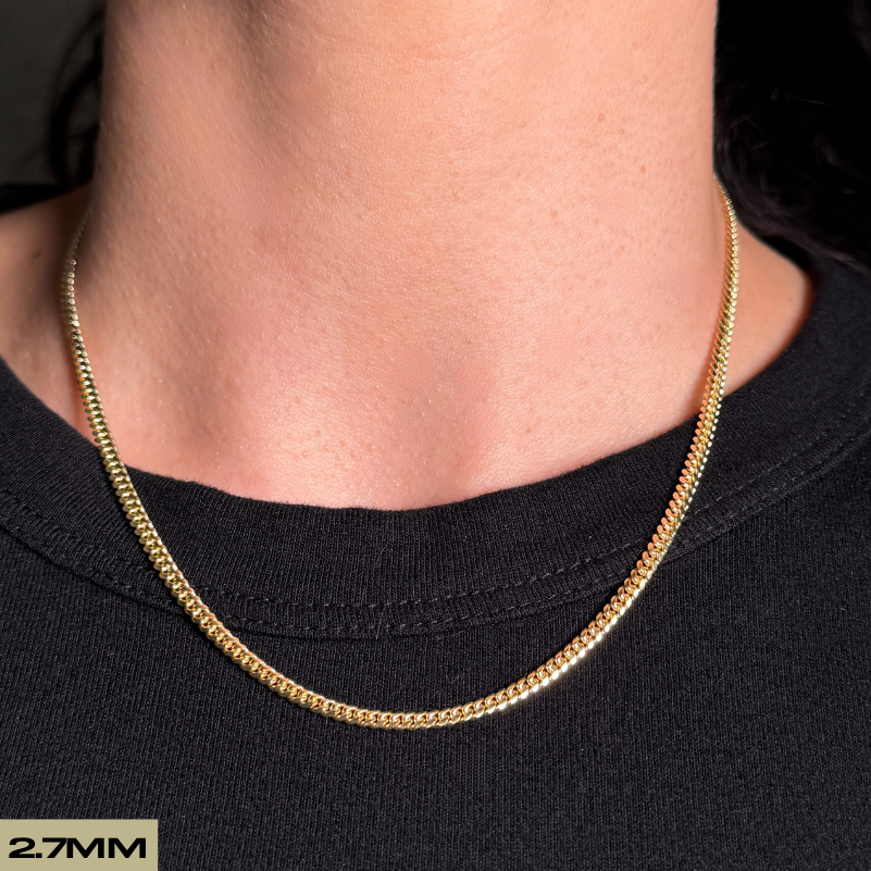 female woman model wearing solid gold cuban chain on neck