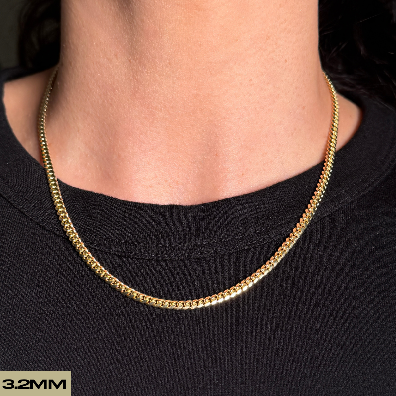 woman wearing 14k soid gold miami cuban made in italy close up on neck
