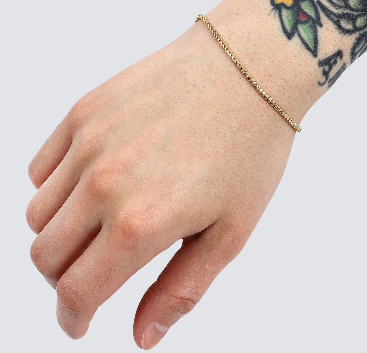 2mm diamond cut gold franco bracelet on mens wrist minimalist 