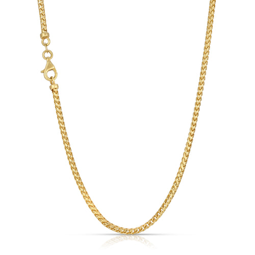 Gold chain necklace on a white background