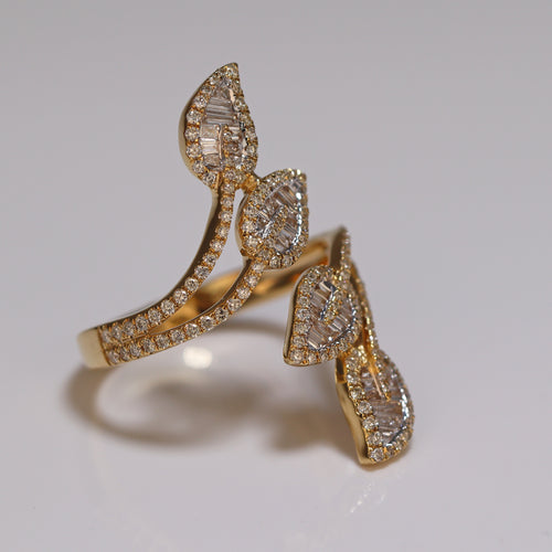 a photo of a ring with a four leaves style and with baguette and princess cut studded diamonds iced out